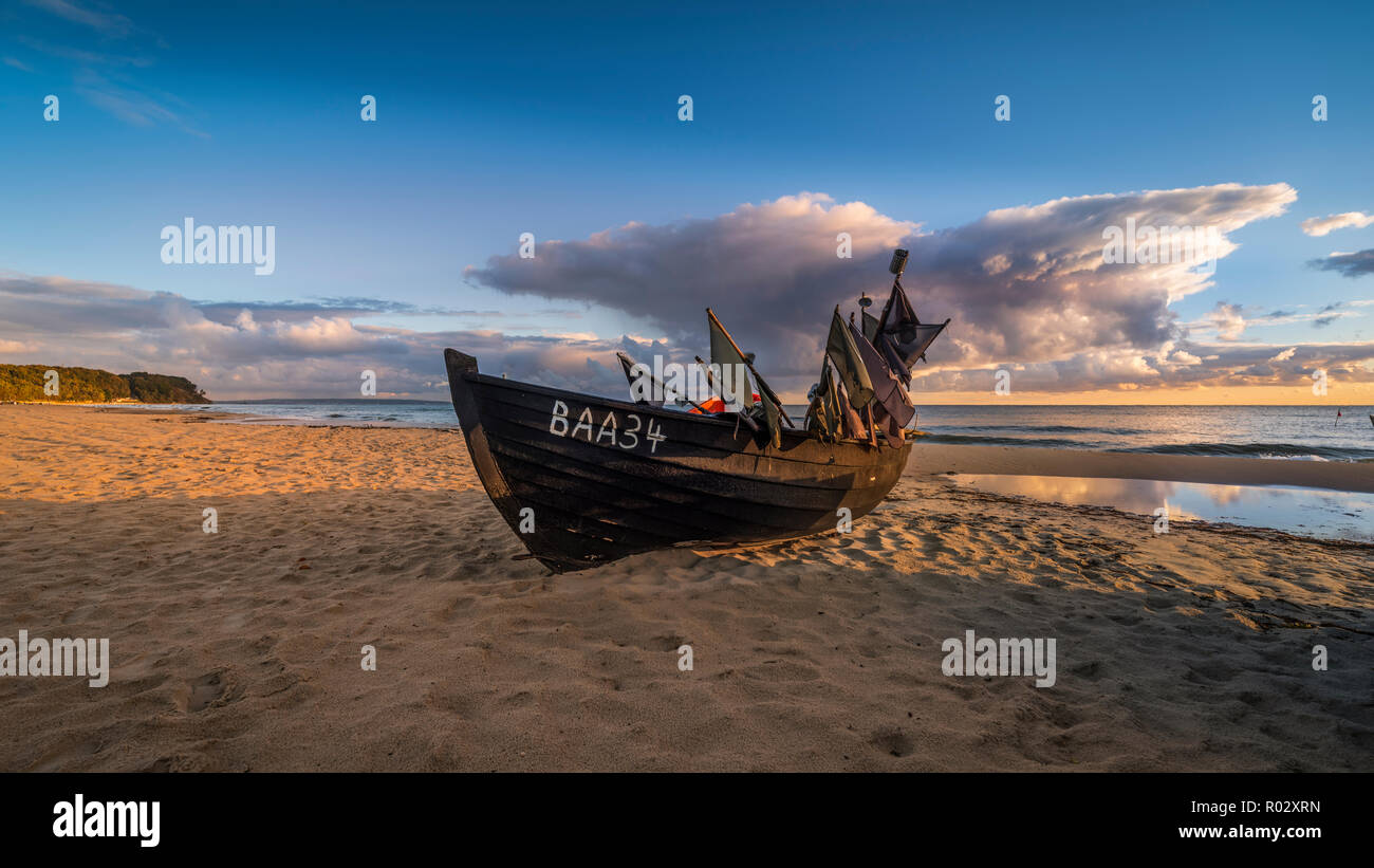 Old fishing boat at the beach on the island of Rügen, Germany | Altes Fischerboot am Strand auf derr Insel Rügen Stock Photo