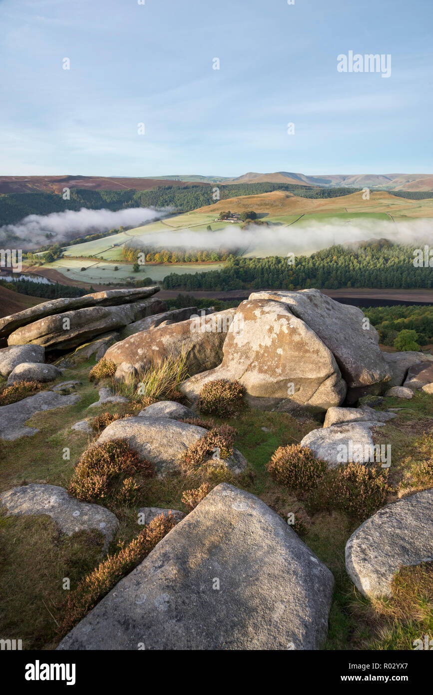 Misty autumn morning at Whinstone Lee Tor on Derwent Edge in the peak ...