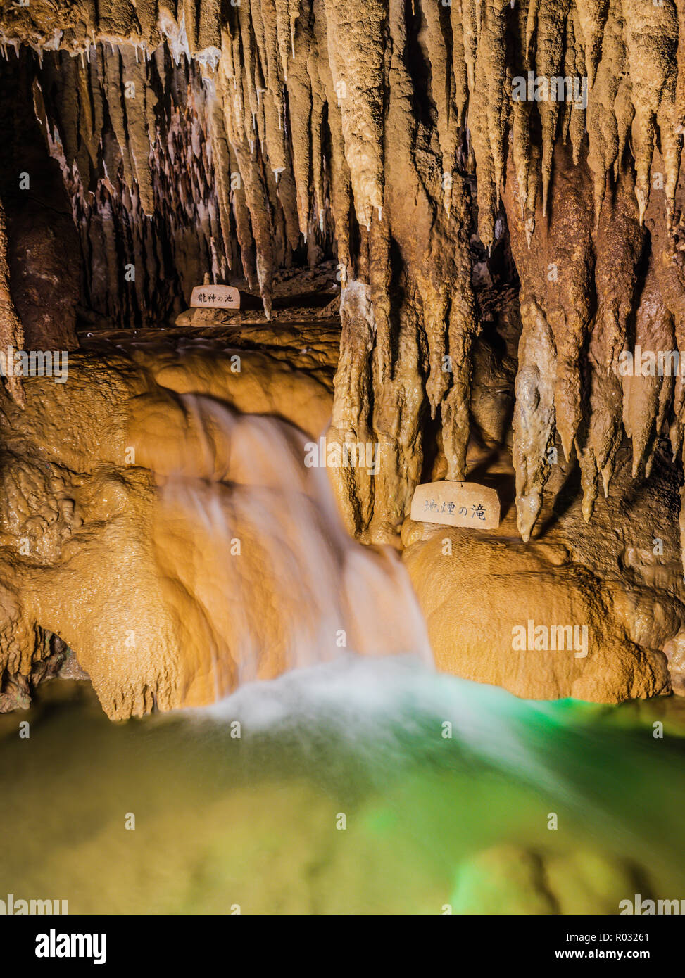 Okinawa / Japan - October 9, 2018: Gyokusendo Cave interior with long exposure of running water at Okinawa World. Stock Photo