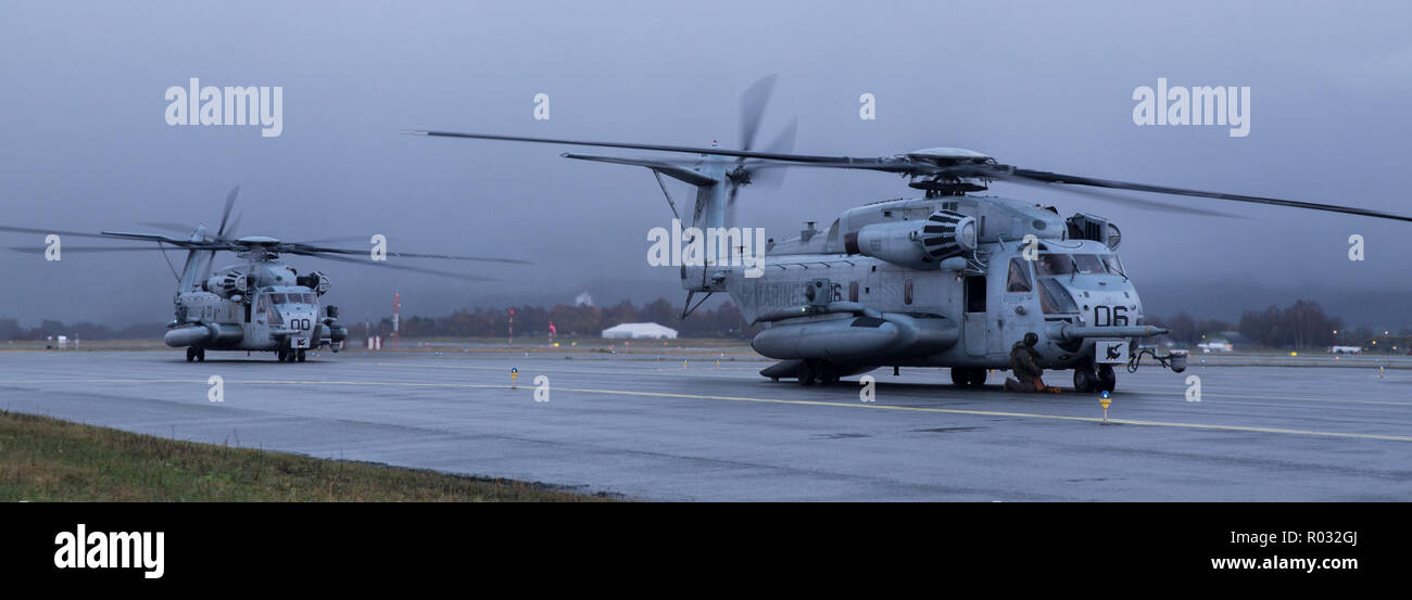 CH-53E Super Stallions park during Trident Juncture 18 in Vaernes Garrison, Norway Oct. 26, 2018. Trident Juncture will allow the air combat element of the Marine Air Ground Task Force to exercise their assault support capabilities for US and allied ground forces.  The aircraft is with Marine Heavy Helicopter squadron 366, Marine Aircraft Group 29.  (U.S. Marine Corps photo by Lance Cpl. Gumchol Cho) Stock Photo