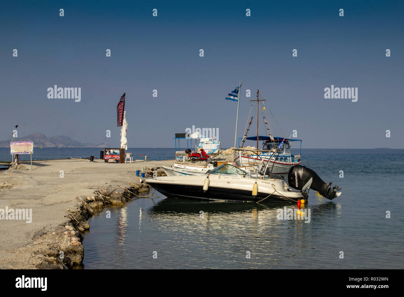 The small boat jetty near the main beach at Kolymbia,Rhodes,Greece. Stock Photo