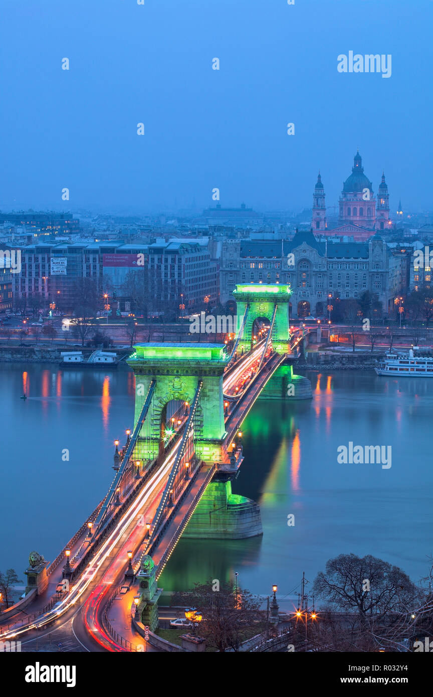 Chain Bridge over River Danube illuminated at dusk, Budapest, Hungary Stock Photo