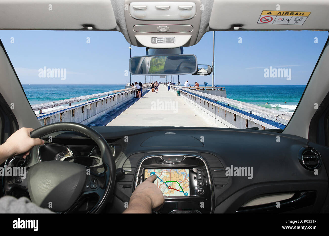 Driving a car while using the touch screen of a GPS navigation system