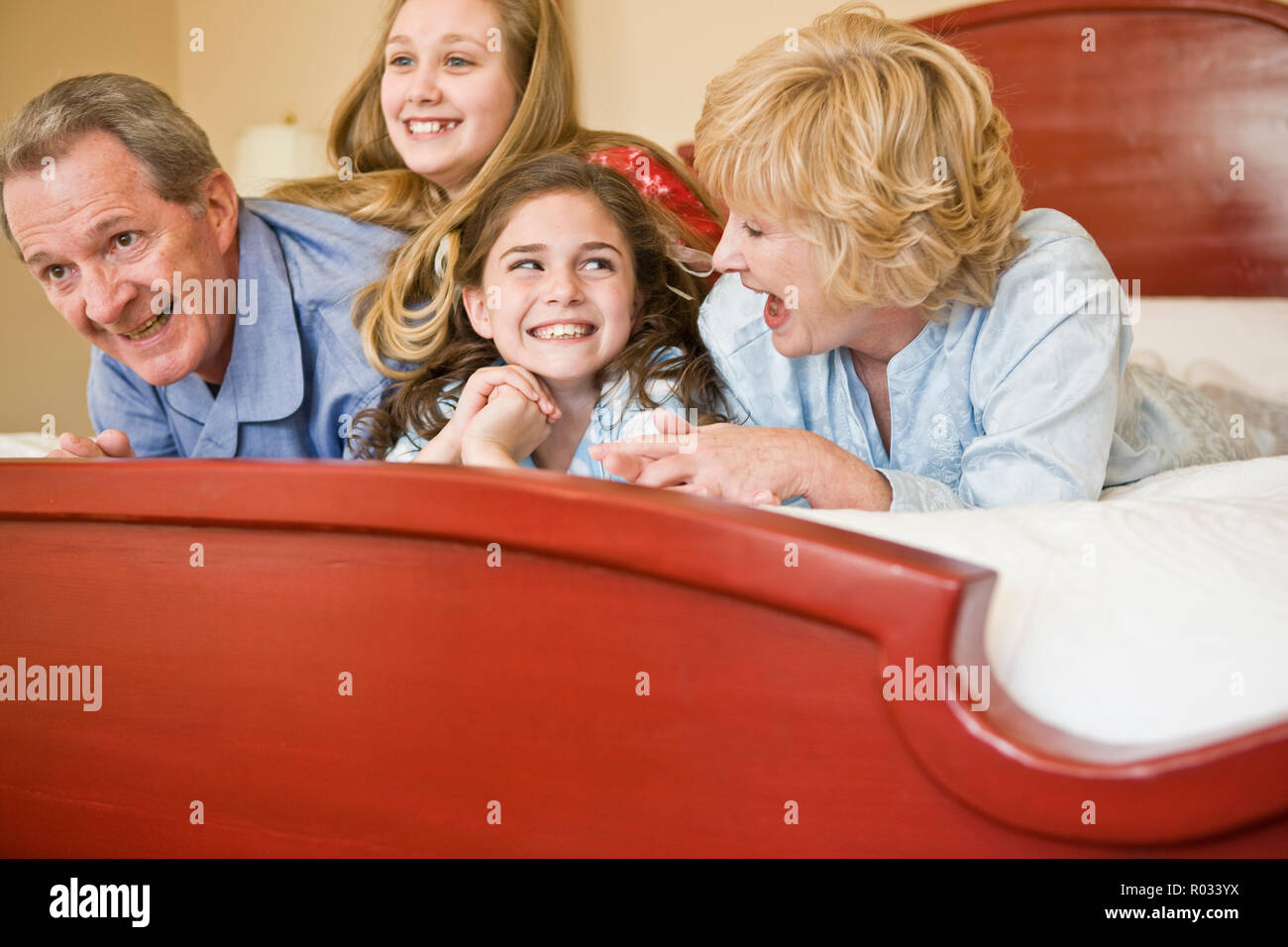 Grandparents with granddaughters in pyjamas Stock Photo