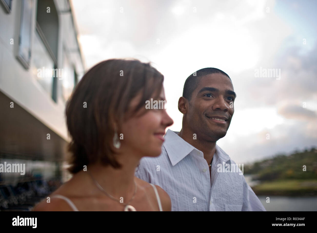 Smiling young man standing next to his partner. Stock Photo