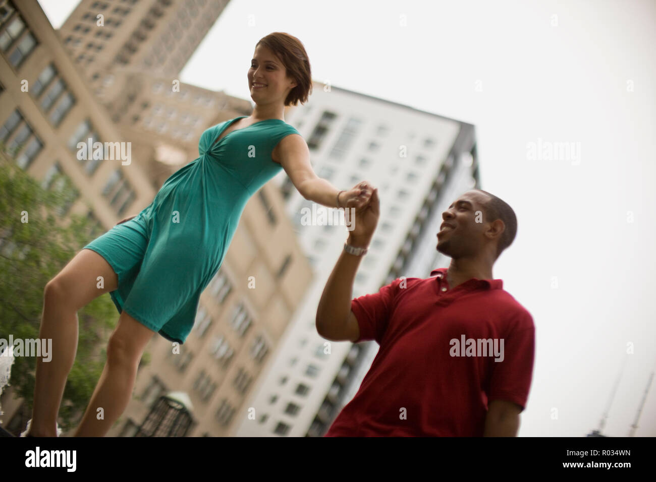 Young man holding his girlfriend's hand. Stock Photo