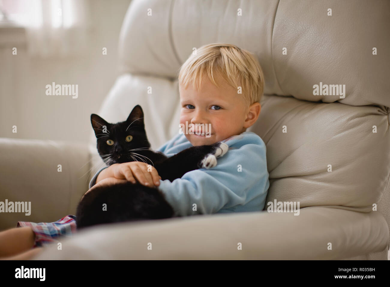 A Young Boy Cuddles His Cat Stock Photo Alamy A Young Boy Cuddles His Cat Stock Photo Alamy