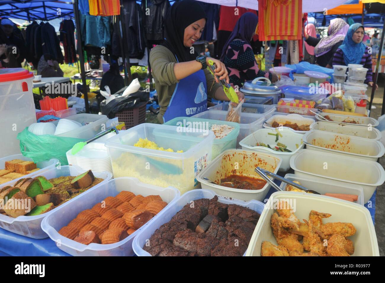 Tamparuli Sabah Malaysia - Aug 8, 2018 : Street food vendor selling cake at open market stall. Street eatery is popular among local and tourist. Stock Photo