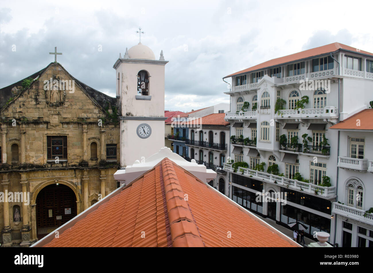 Charming Casco Viejo buildings. La Merced Church is on the left and a luxury hotel is on the right. Stock Photo