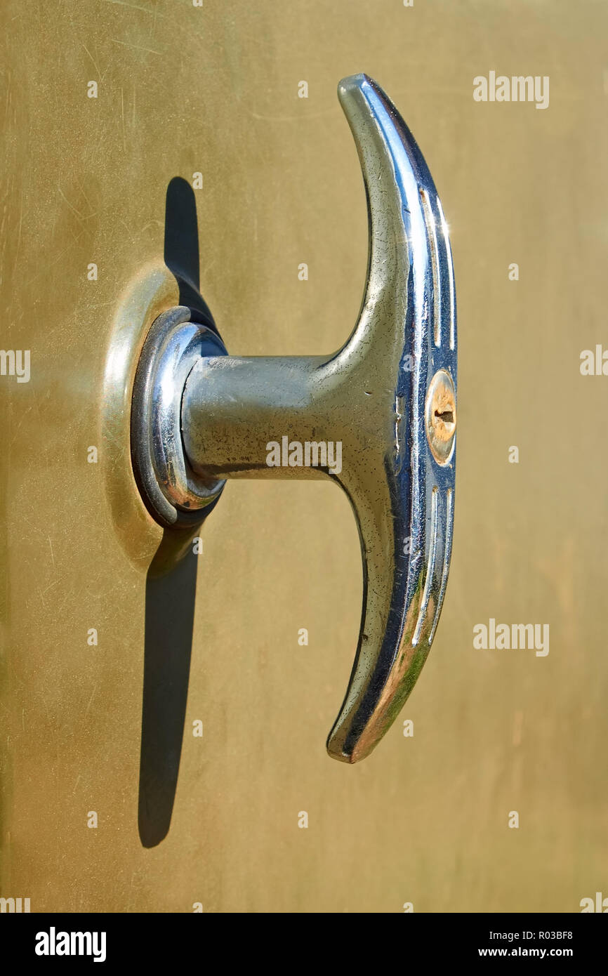 Old nickelplated doors handle with integrated lock Stock Photo Alamy