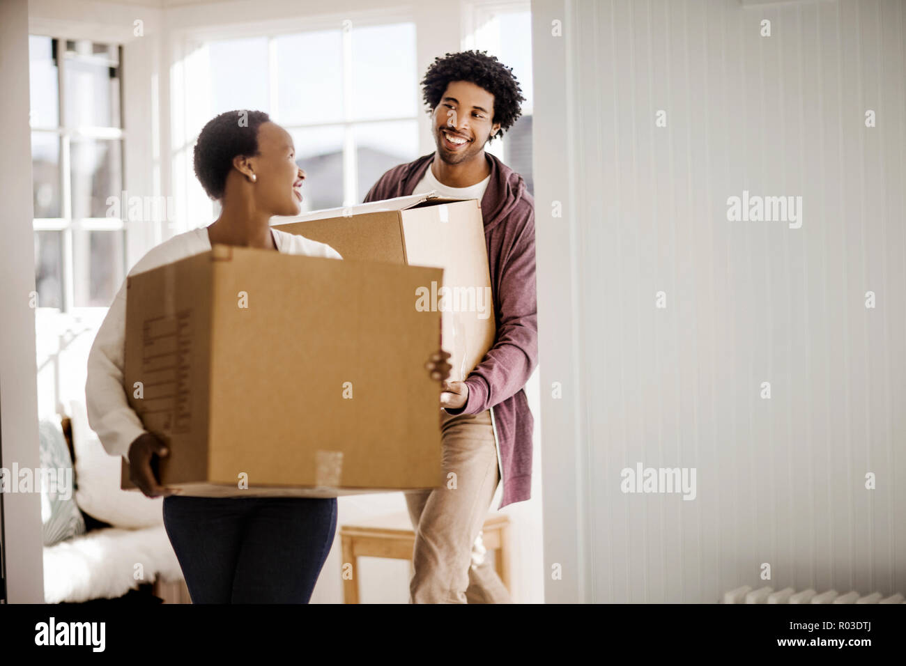 Happy couple moving into their new home Stock Photo - Alamy