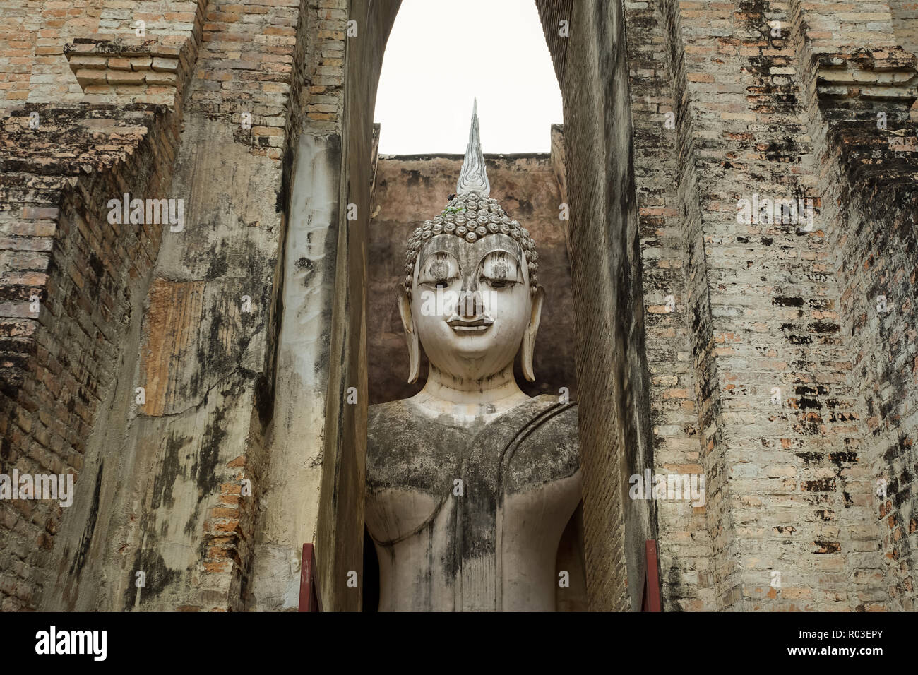 13th century temple enshrining, the largest Buddha image in Sukhothai, Thailand. Phra Achana in Wat Si Chum. Stock Photo
