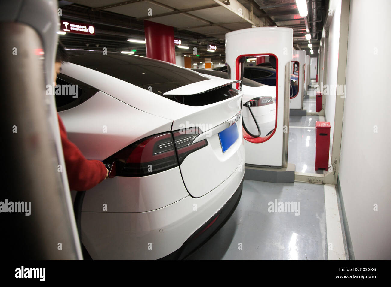 Electric vehicle charging Stock Photo - Alamy