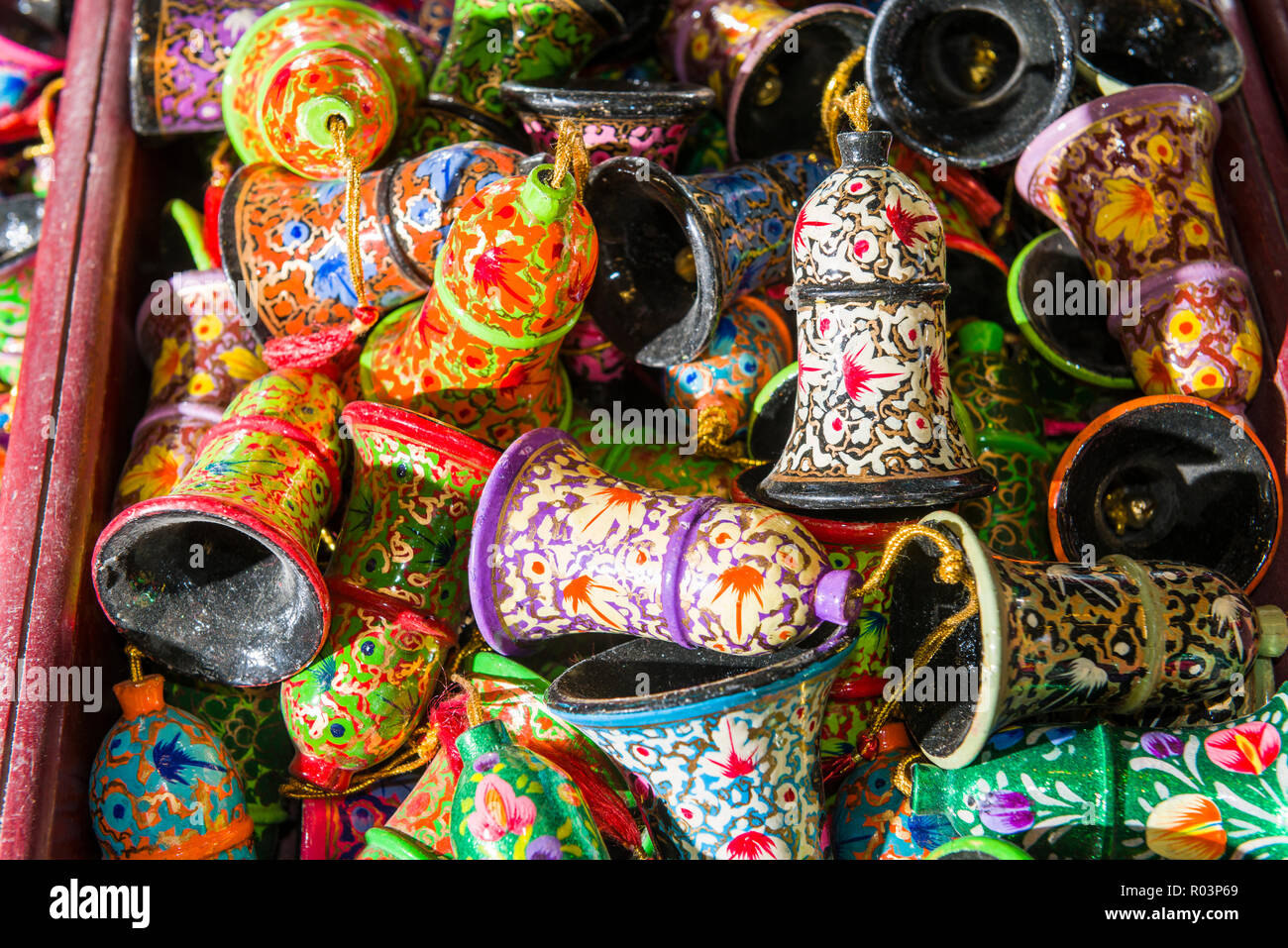 Paper mache is the material for many kashmiri souvenirs like bells, sold in little shops along Dal Lake Stock Photo