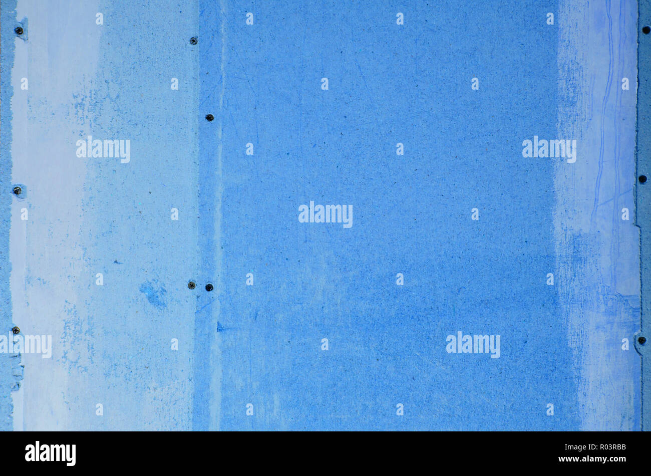 wall of hardboard with traces of glue and paint. toned Stock Photo Alamy