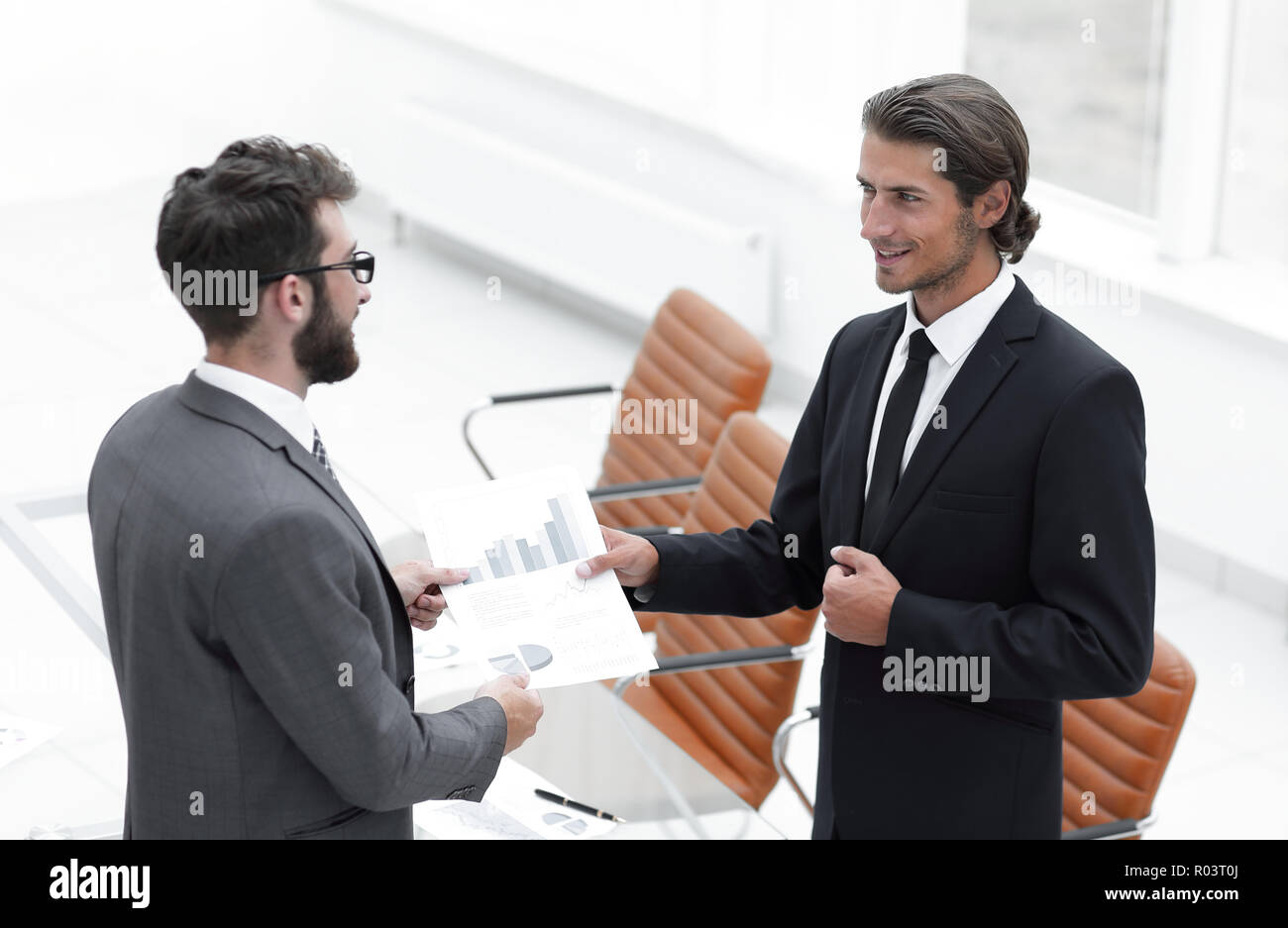 two businessmen talking in the office Stock Photo - Alamy