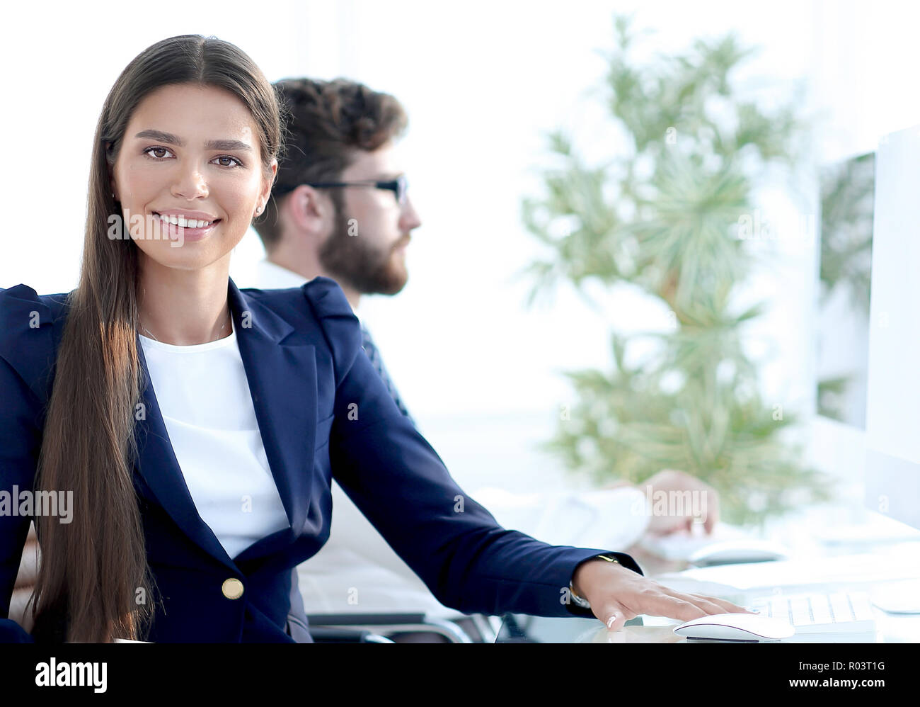 young business woman sitting at Desk Stock Photo - Alamy
