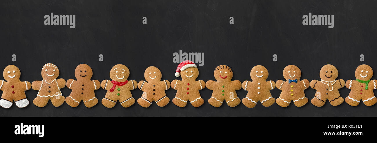 Many Gingerbread men on a blackboard Stock Photo