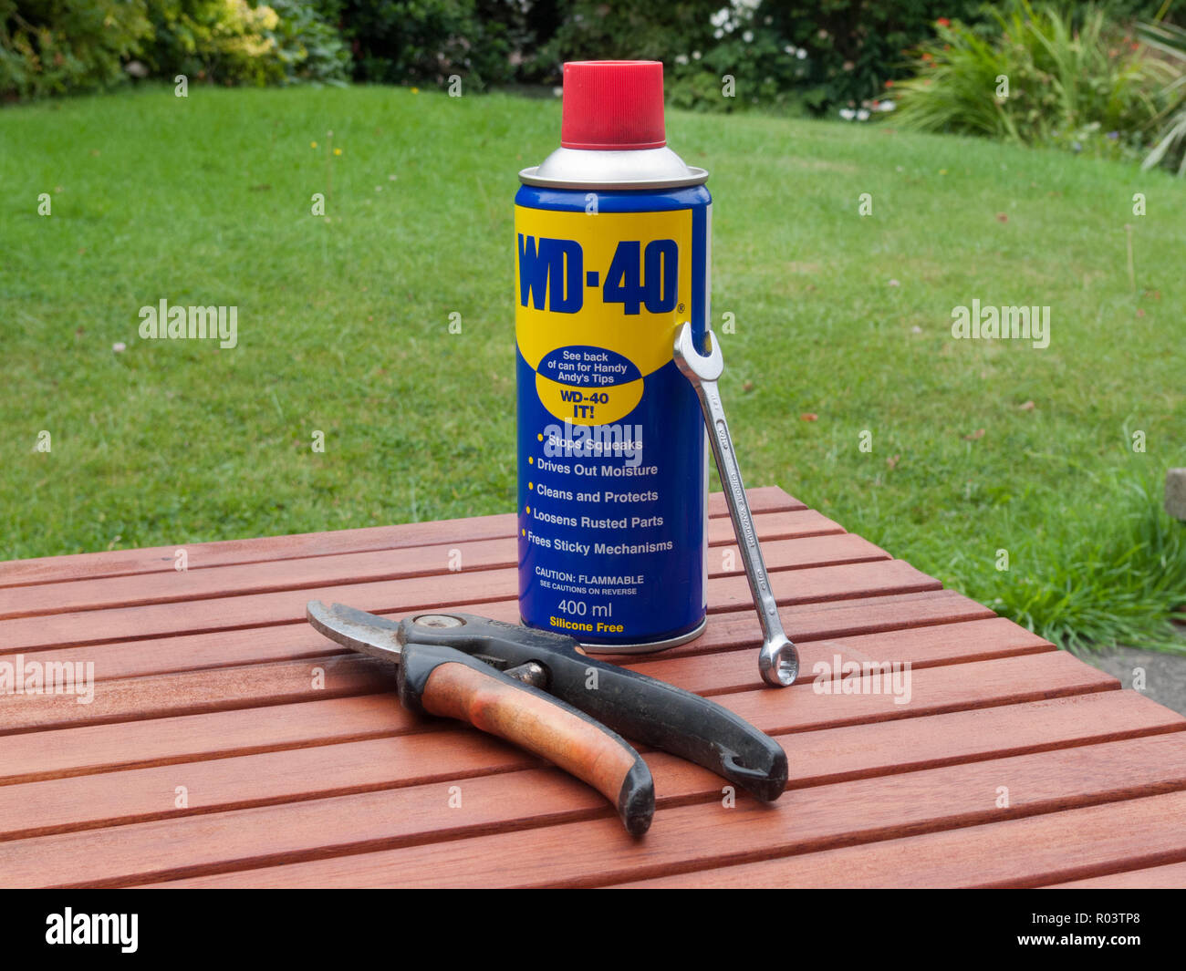 Aerosol Can of WD-40 Lubricant Spray With Secateurs and a Spanner, UK Stock Photo