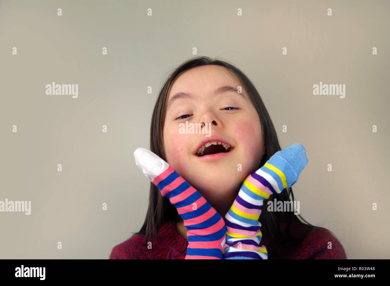 Beautiful girl smiling with socks Stock Photo