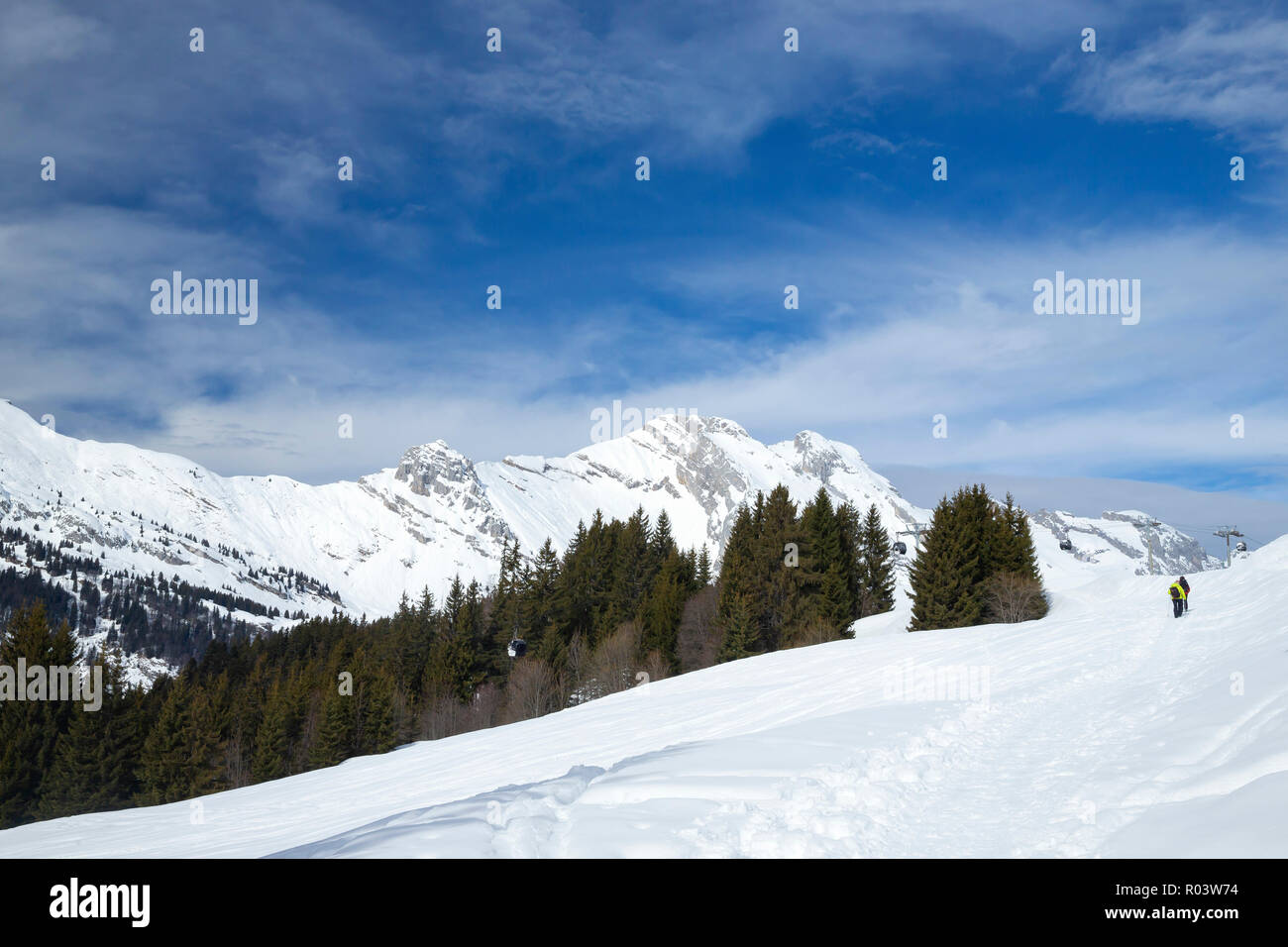 Couple snowshoeing in Le Grand-Bornand, Haute-Savoie, France, Stock Photo