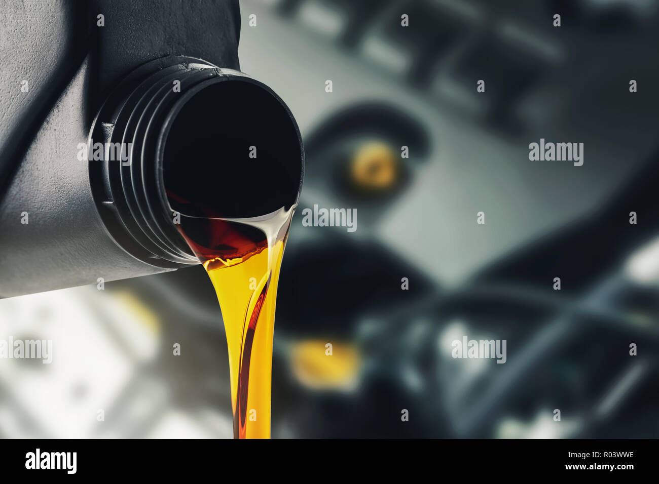 pouring changing car engine oil Stock Photo