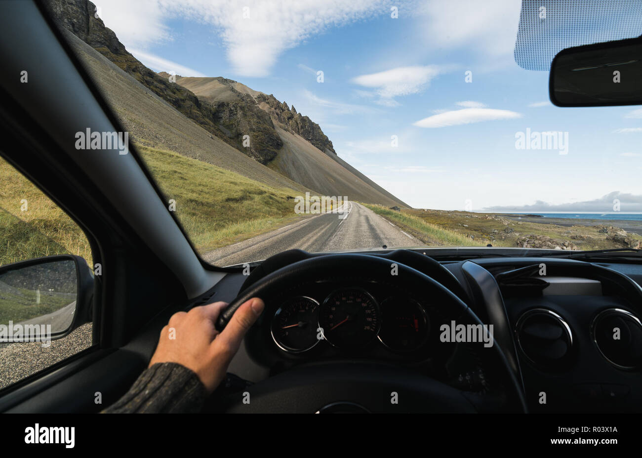 https://c8.alamy.com/comp/R03X1A/view-from-drivers-seat-over-the-coastal-road-at-the-south-of-iceland-R03X1A.jpg