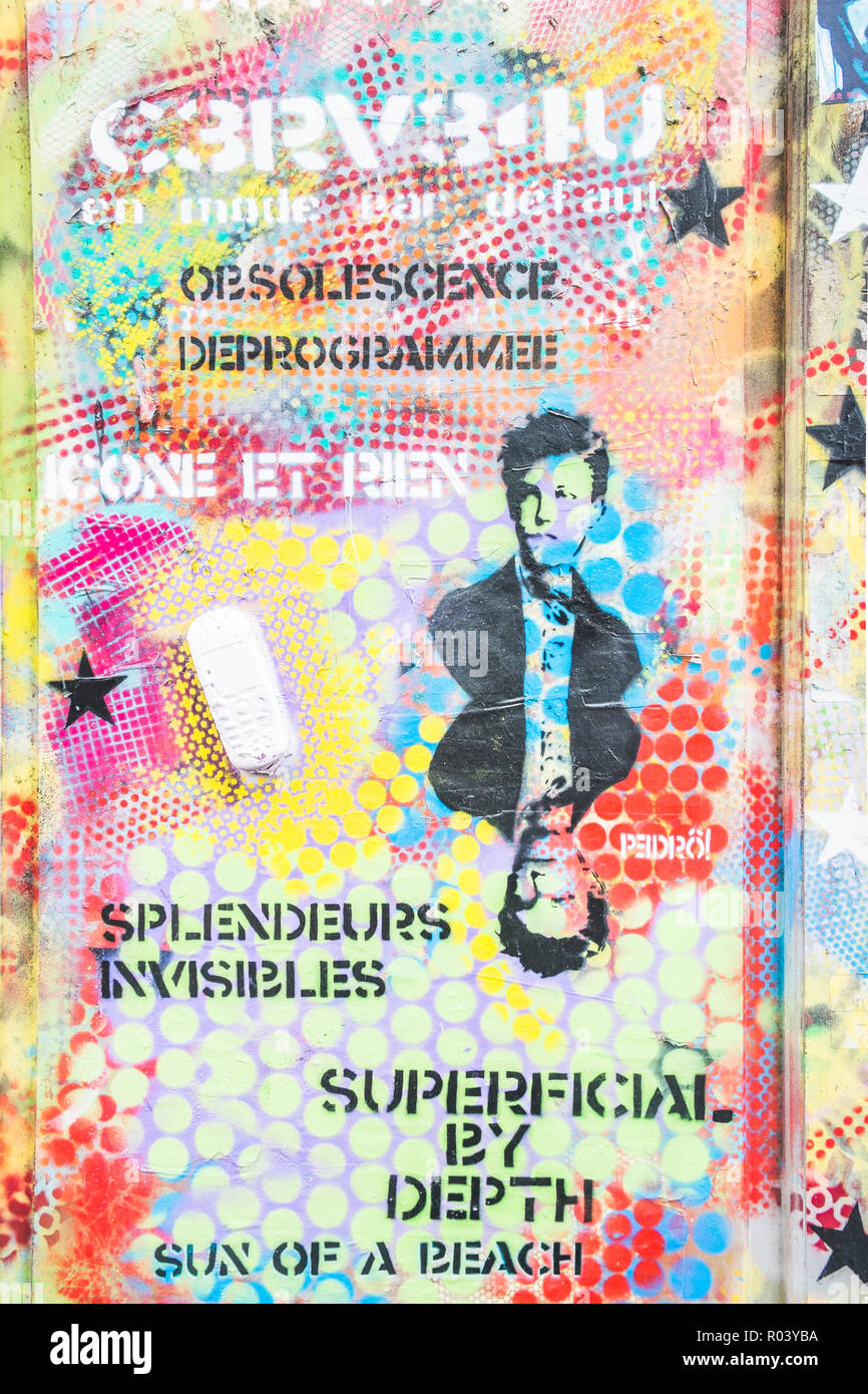 stencil portrait of french poet arthur rimbaud on a graffiti covered wall Stock Photo