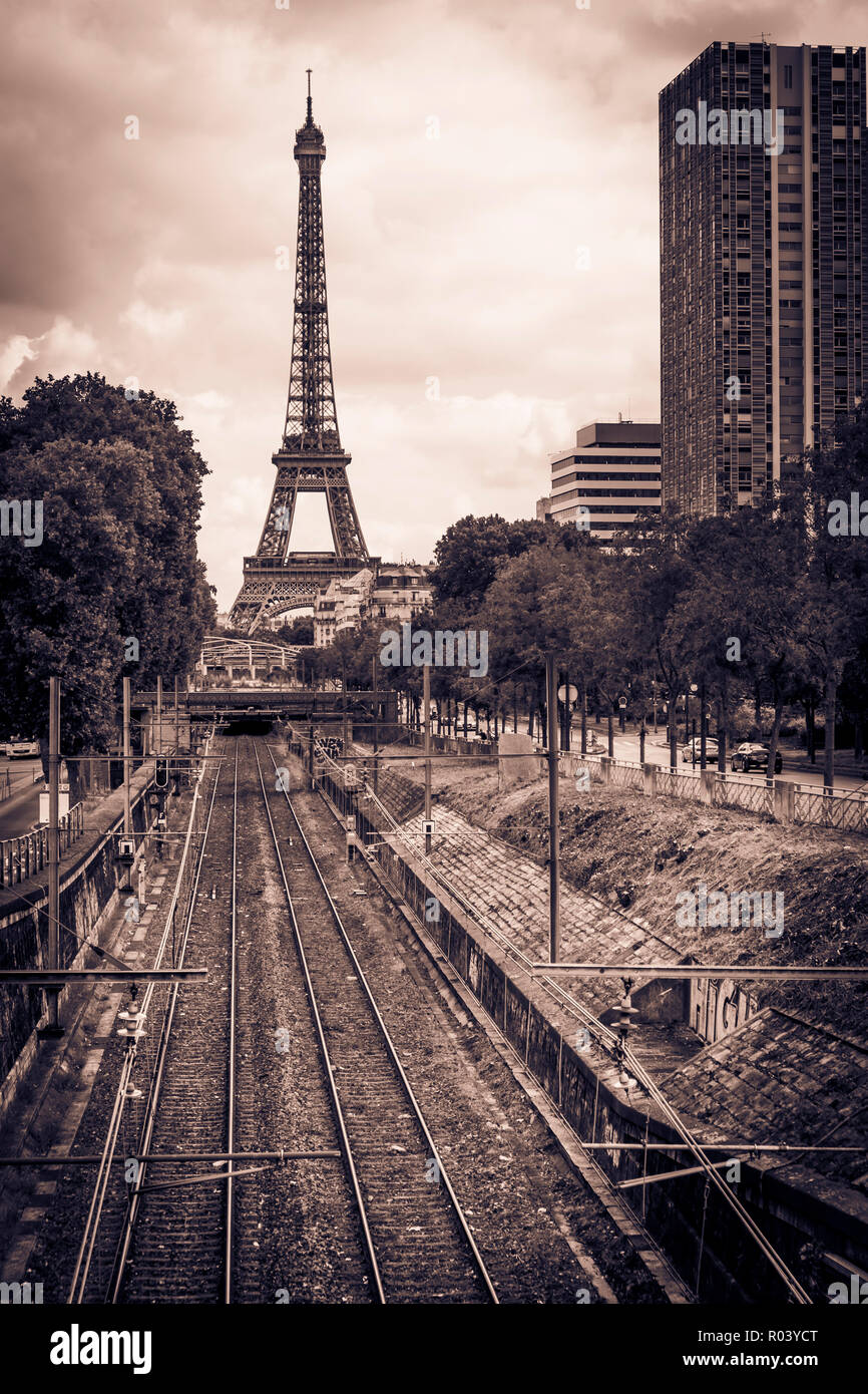 eiffel tower railroad tracks and high-rise residential buildings Stock Photo