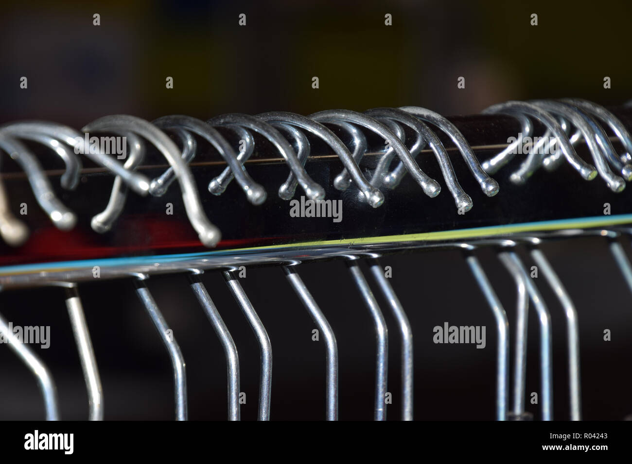 Clothes Rack Macro close-up hangers background, metal clothes hangers on clothes rail ...