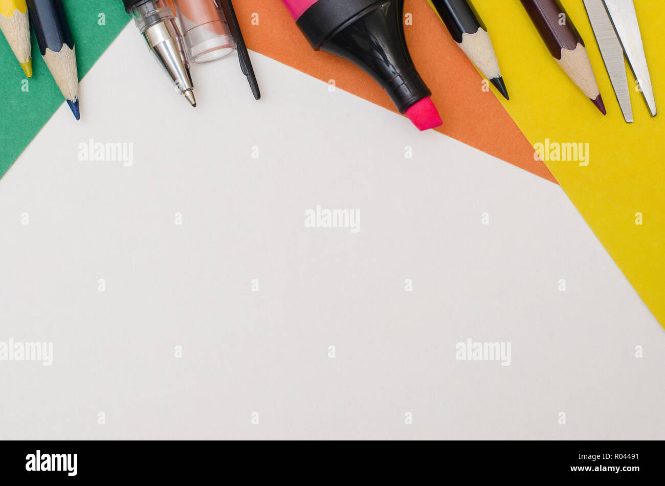School supplies, stationery accessories on paper background. Top view. Stock Photo