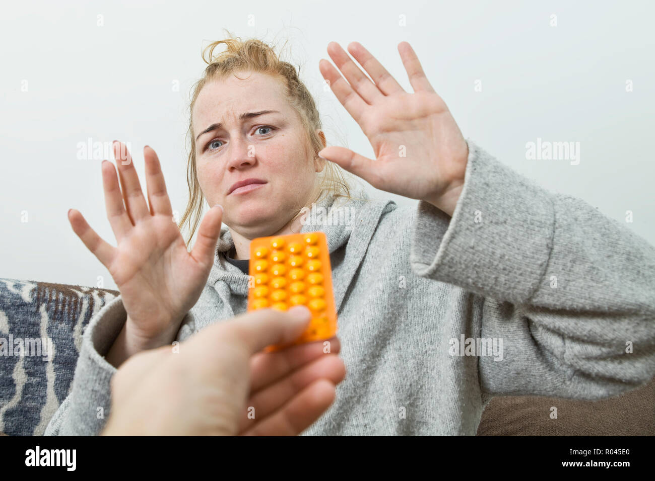 Stop taking drugs and mediines. Woman defends herself from drugs Stock Photo