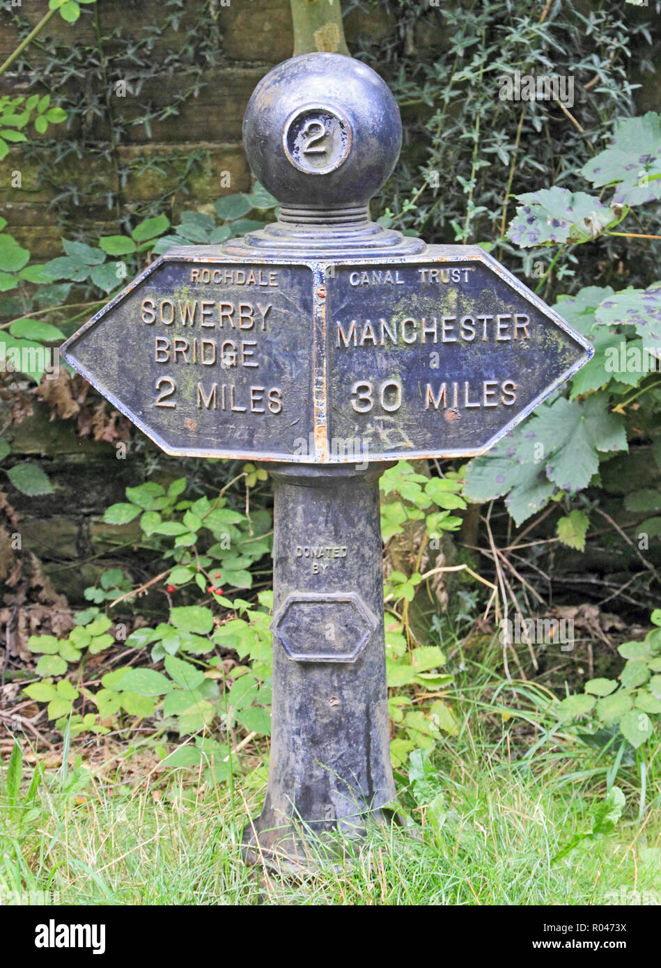 Milepost at mile 2 on Rochdale Canal Stock Photo
