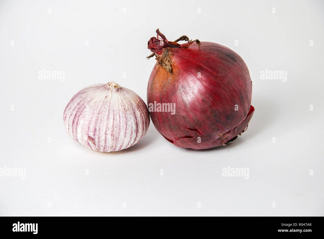 Garlic and onions isolated on white background Stock Photo - Alamy