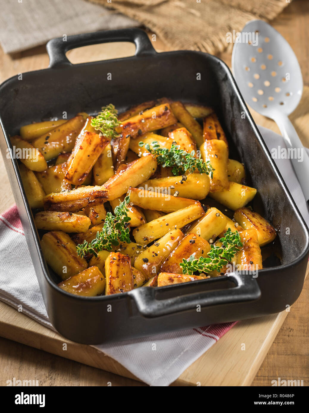 Honey roast parsnips Stock Photo