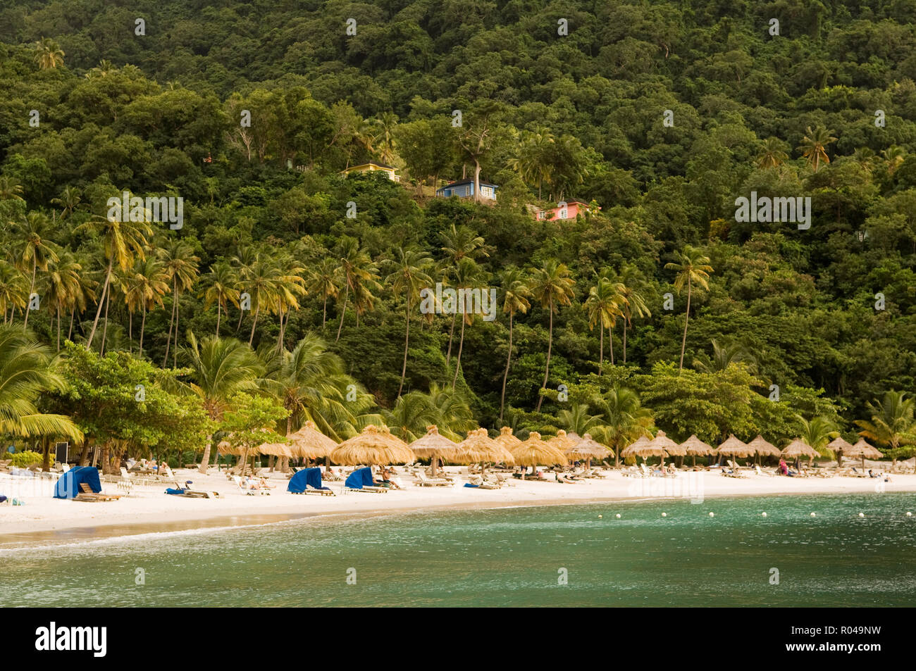 Parasols on tropical beach Stock Photo