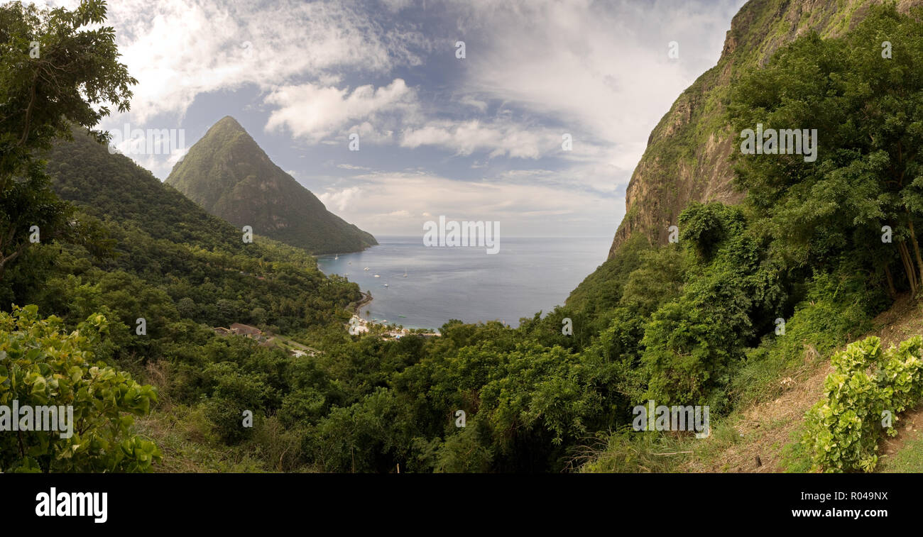 Landscape of forest covered hills by sea Stock Photo