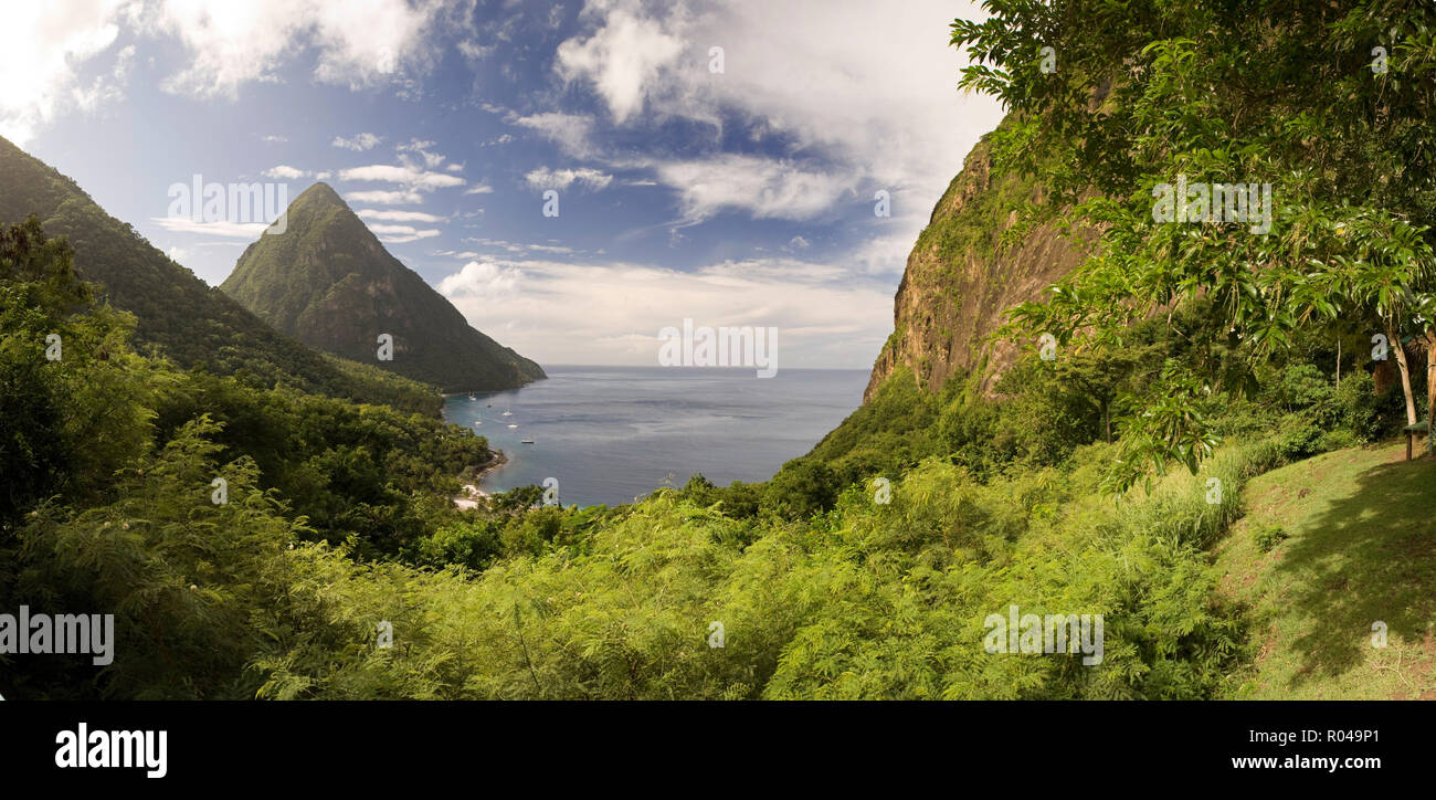 Landscape of forest covered hills by sea Stock Photo