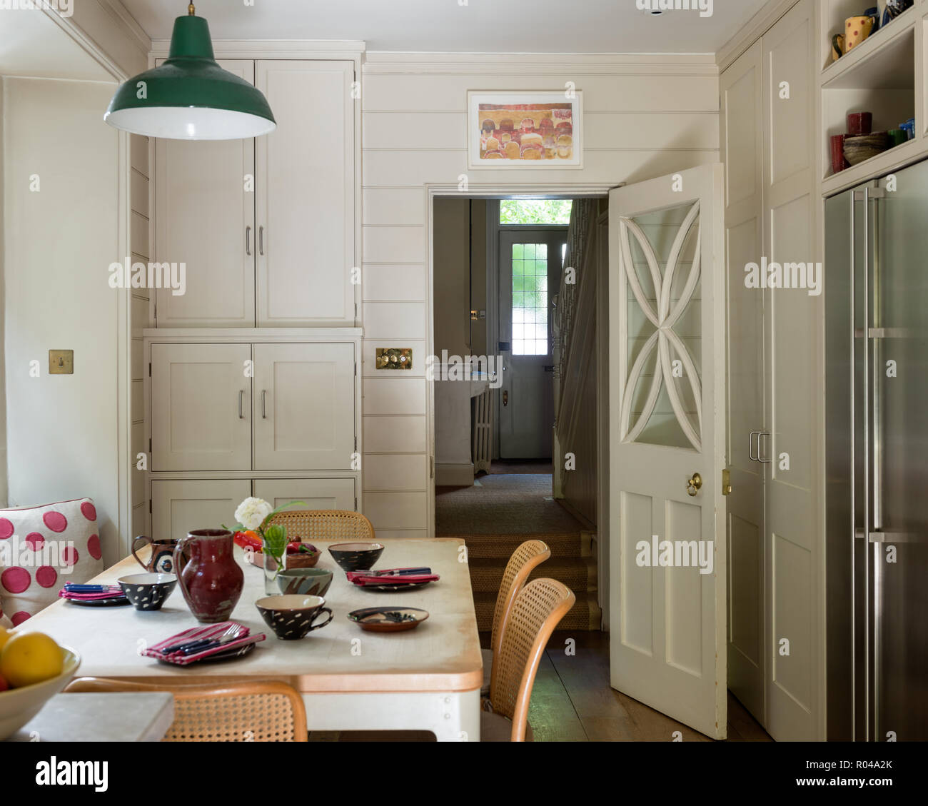 Dining area in country style kitchen Stock Photo - Alamy