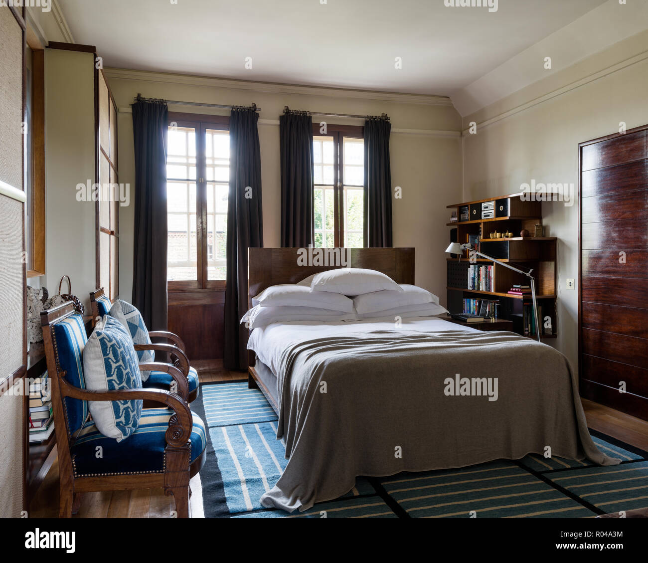 Bedroom with matching armchairs Stock Photo Alamy