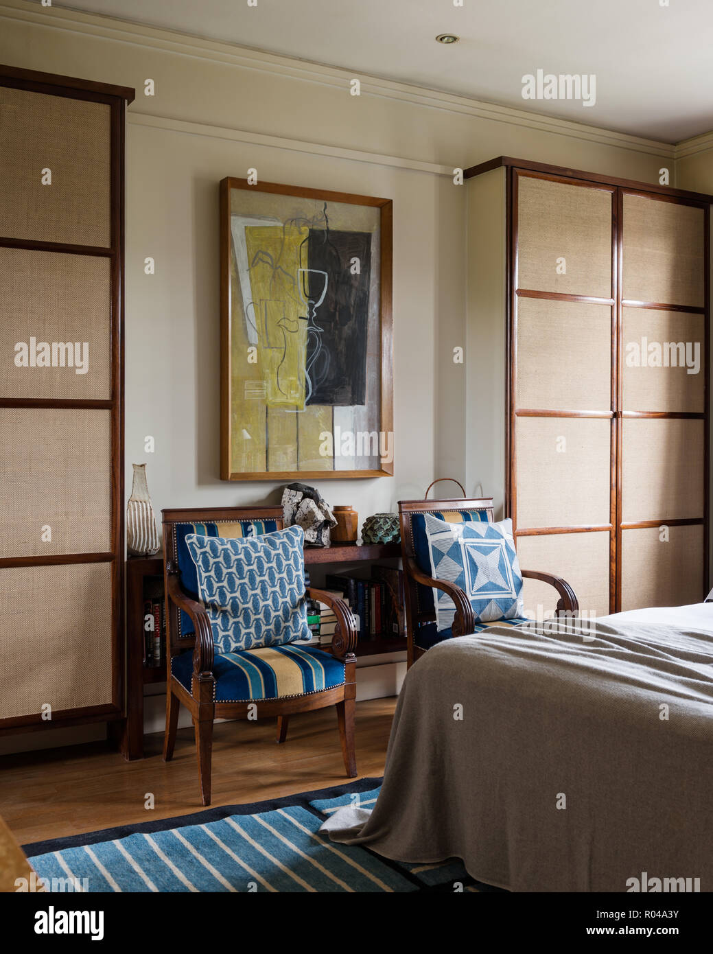 Bedroom with matching armchairs Stock Photo Alamy