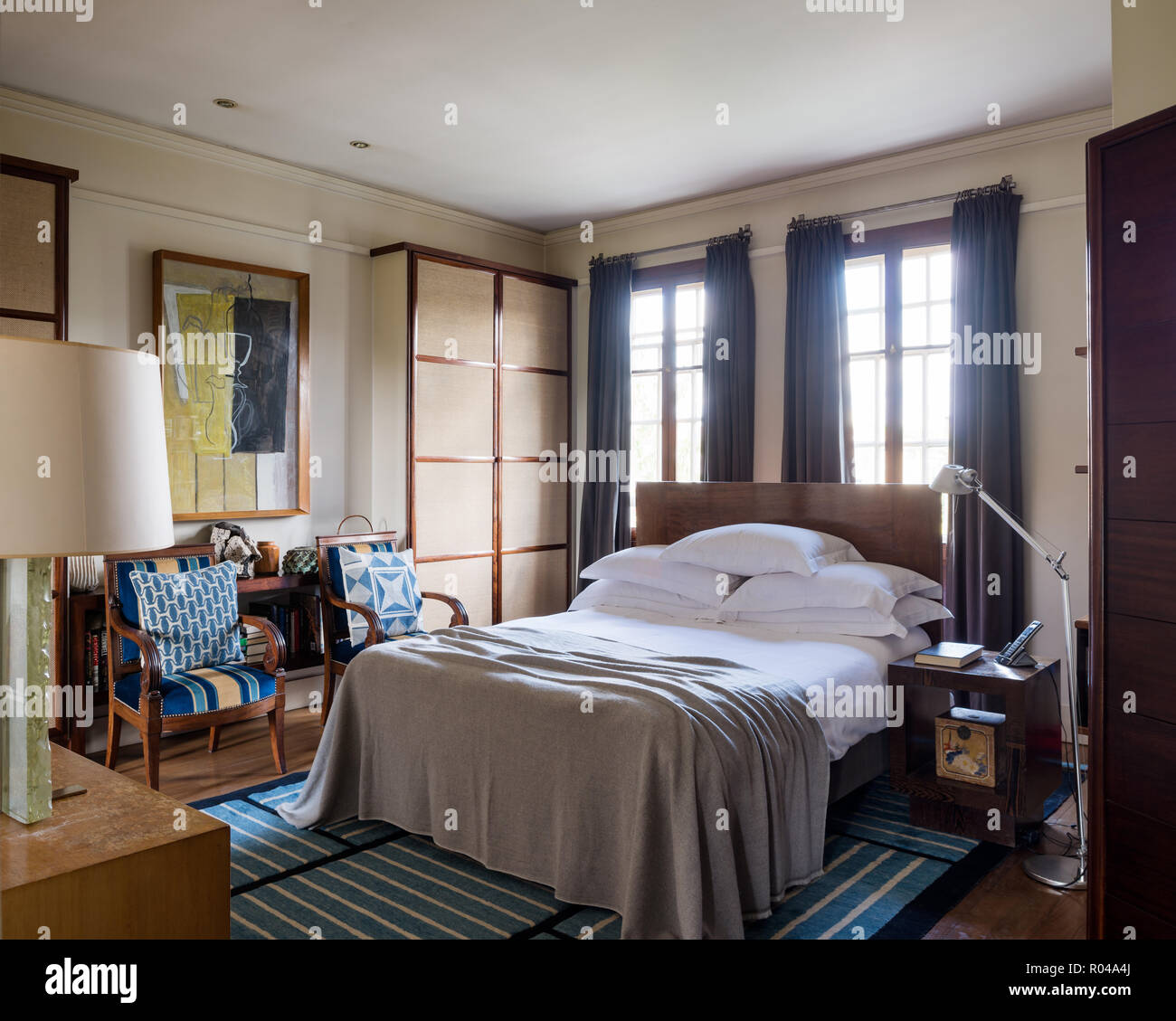 Bedroom with matching armchairs Stock Photo Alamy