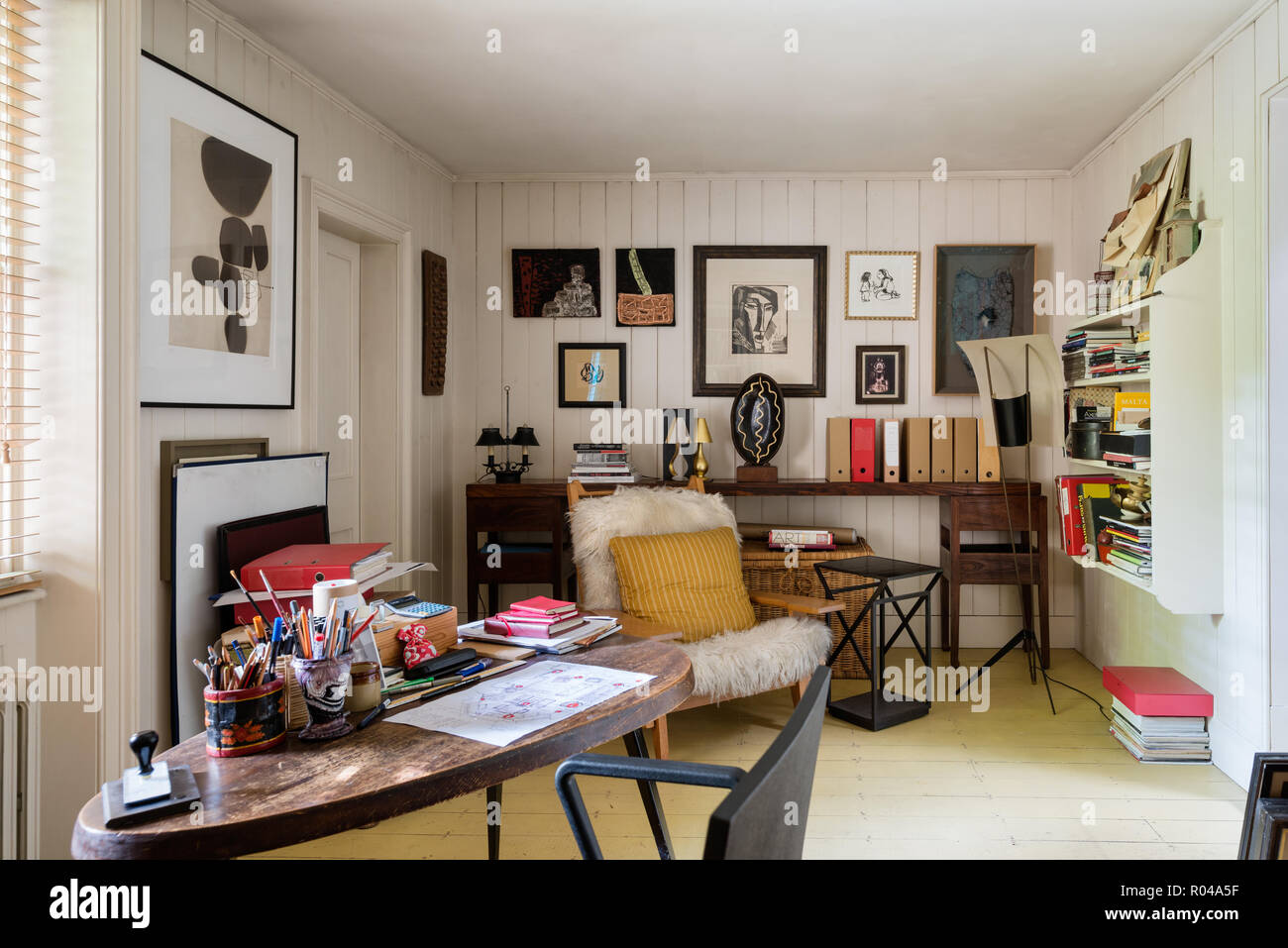Eclectic office with artworks Stock Photo