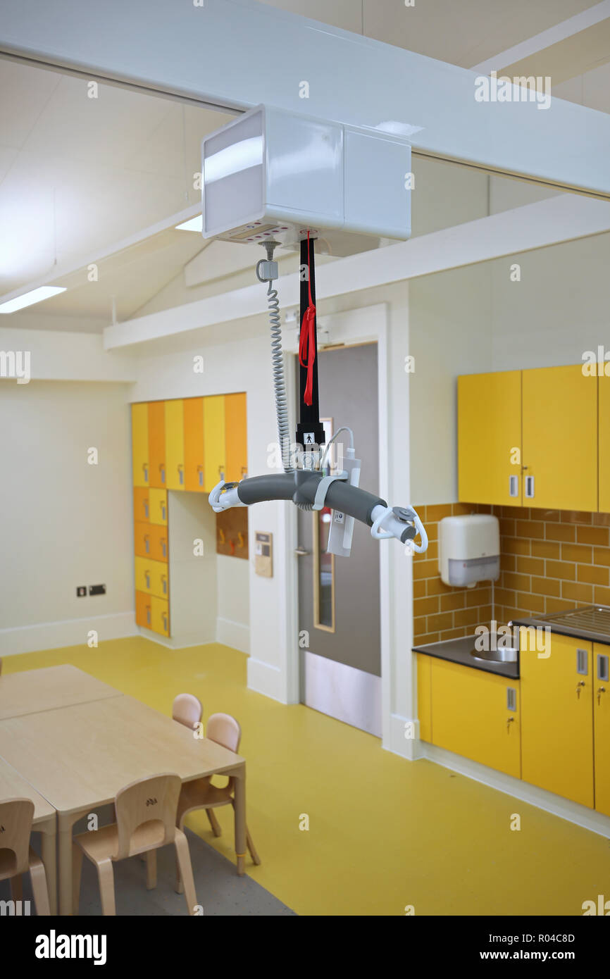 Close-up of a rail-mounted disabled hoist in a brand new special school for children with severe learning difficulties, Southwark, London, UK Stock Photo