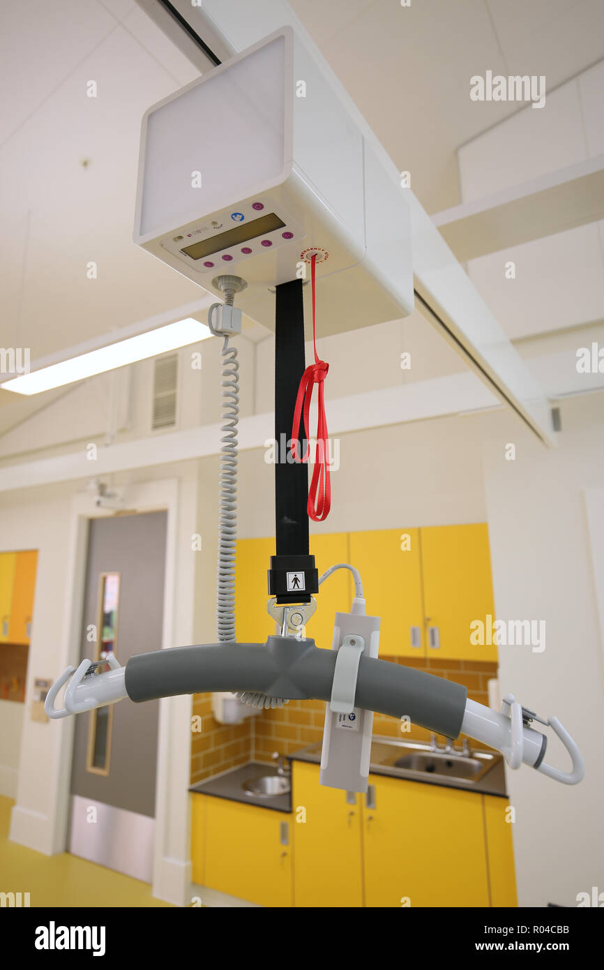 Close-up of a rail-mounted disabled hoist in a brand new special school for children with severe learning difficulties, Southwark, London, UK Stock Photo