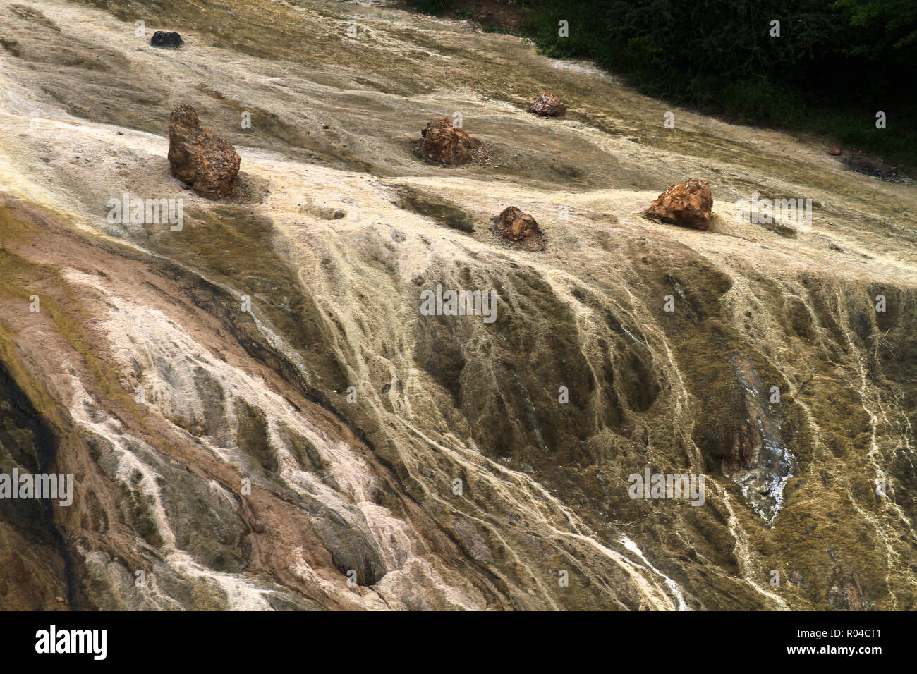 Sulfur deposites at Se Khat Tala waterfall in Gadook Stock Photo