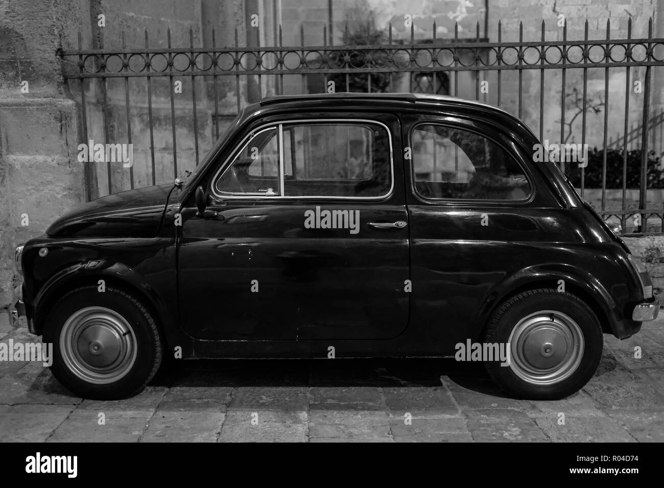 Lecce, Ital. Black Fiat vintage cinquecento 500 car parked in front of ...