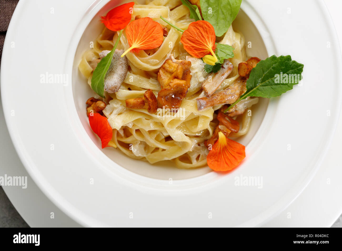 Pasta with chanterelles mushrooms and cheese Stock Photo Alamy
