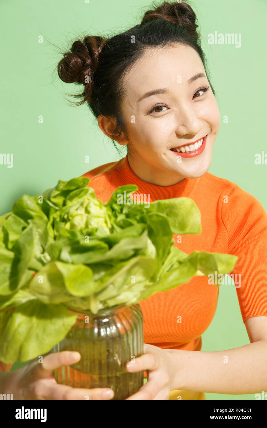 Young women and vegetables Stock Photo - Alamy