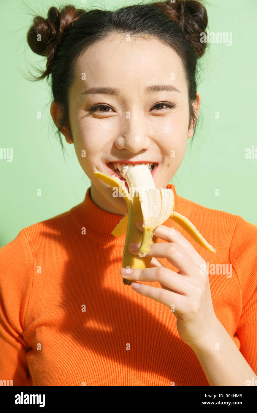 Chinese woman eating banana hires stock photography and images Alamy